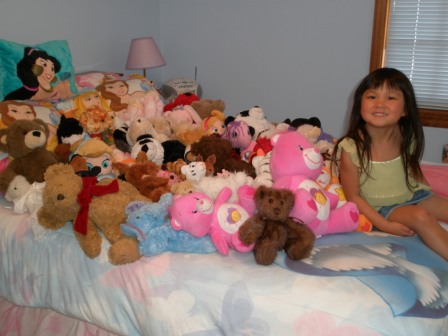 Kasen with her stuffed animal friends